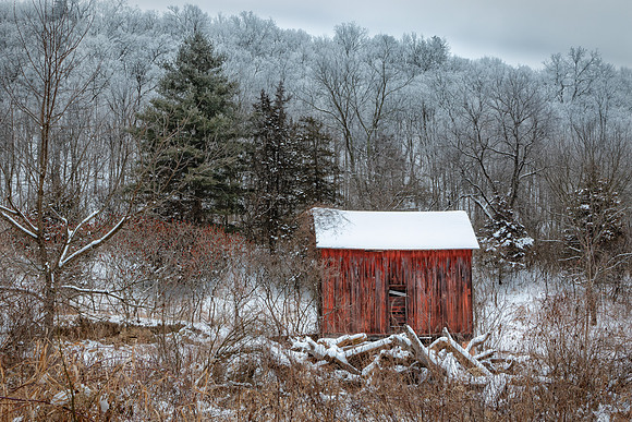 A Rustic Red Barn in a Wintry Valley